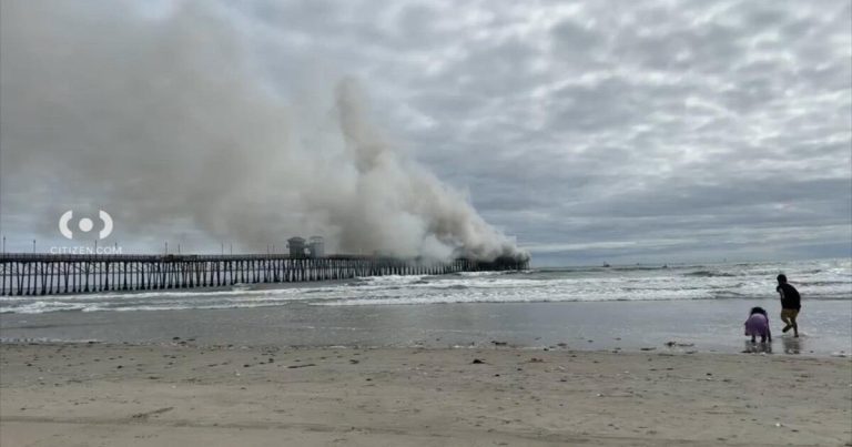 Oceanside pier engulfed in flames. Firefighters respond