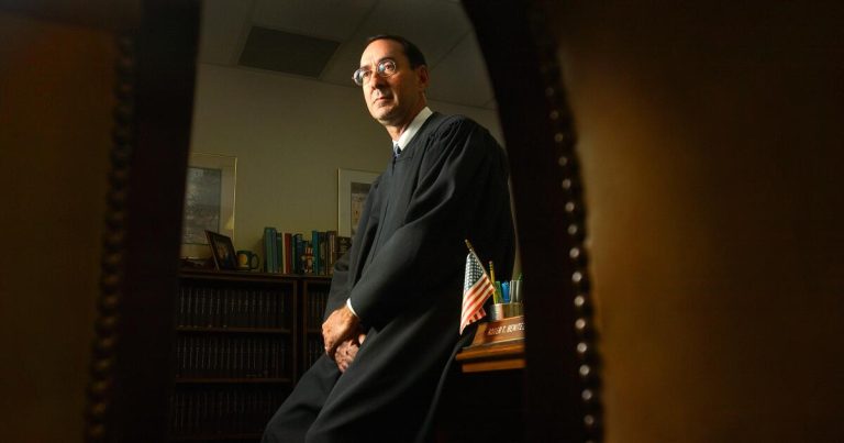 Judge in major gun cases reprimanded after girl handcuffed in court